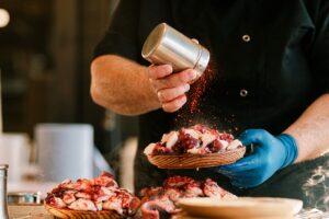 Chef preparing Galician style octopus dish